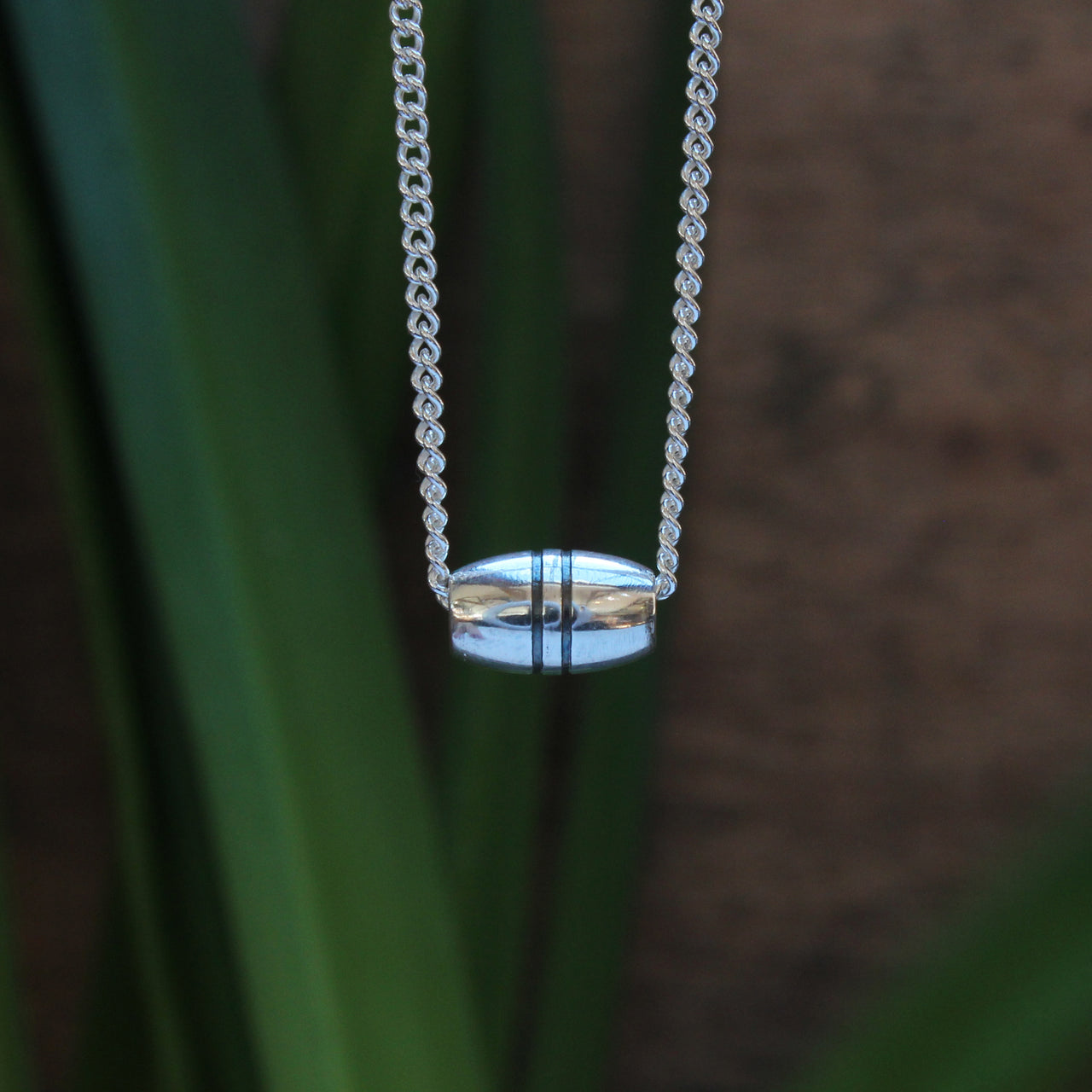 Float charm - silver with oxidised ridges