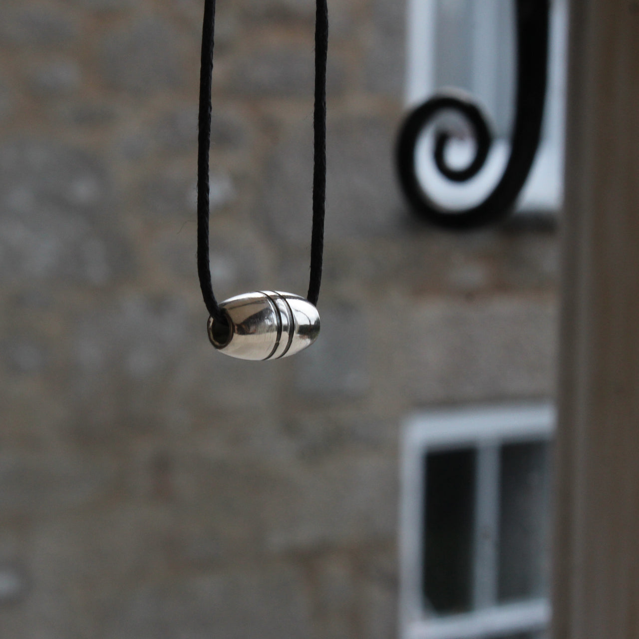 Float charm - silver with oxidised ridges