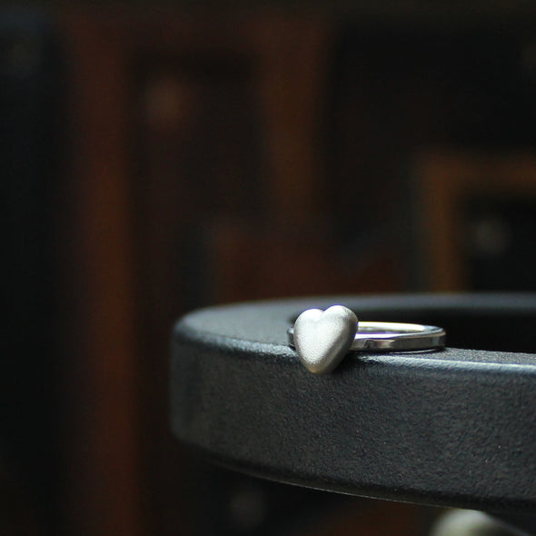 Pebble heart on a silver ring