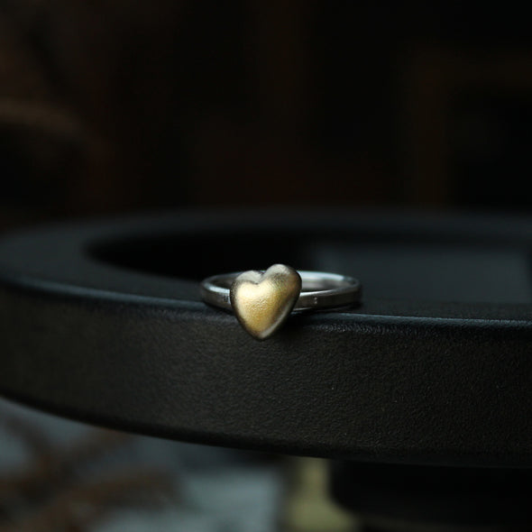Solid 9ct gold heart on a silver ring